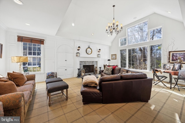 845 Colony Ct, Bryn Mawr, PA 19010 - living room with a chandelier, a tiled fireplace, recessed lighting, and high vaulted ceiling