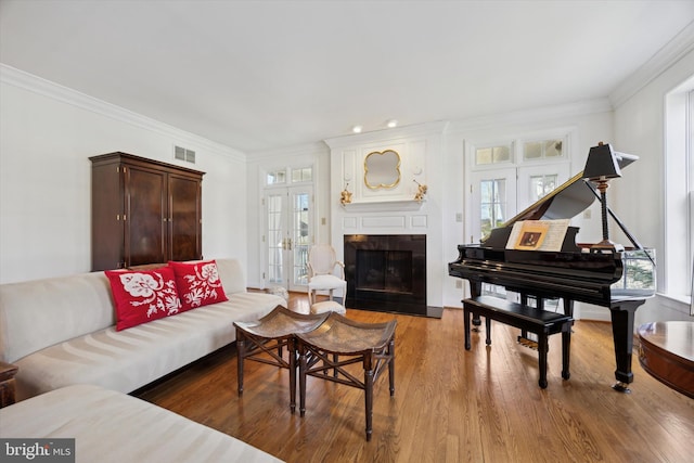 845 Colony Ct, Bryn Mawr, PA 19010 - living area with plenty of natural light, a fireplace, wood finished floors, and ornamental molding