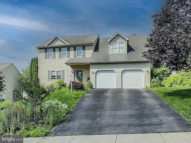 25 Domenick Dr, York, PA 17402 - view of front facade featuring driveway, a garage, and roof with shingles