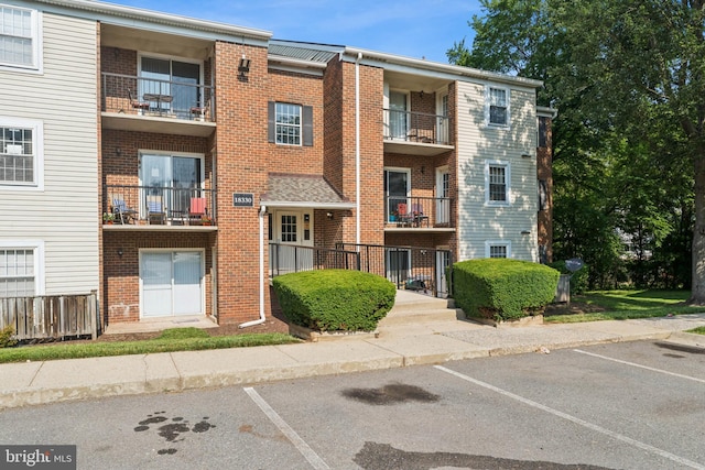 18330 Streamside Dr Unit 303, Gaithersburg, MD 20879 - view of apartment building / complex with uncovered parking