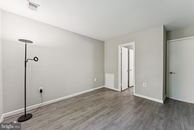 18330 Streamside Dr Unit 303, Gaithersburg, MD 20879 - unfurnished bedroom featuring wood finished floors and baseboards