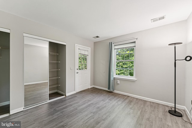 18330 Streamside Dr Unit 303, Gaithersburg, MD 20879 - unfurnished bedroom featuring wood finished floors and baseboards