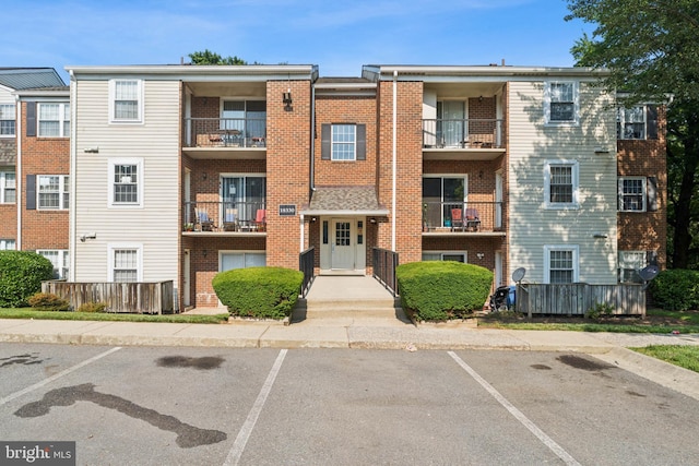 18330 Streamside Dr Unit 303, Gaithersburg, MD 20879 - view of apartment building / complex with uncovered parking