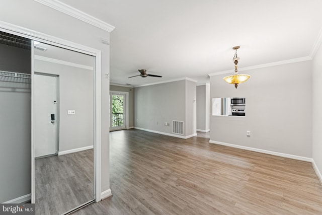 18330 Streamside Dr Unit 303, Gaithersburg, MD 20879 - unfurnished living room featuring crown molding, wood finished floors, and a ceiling fan