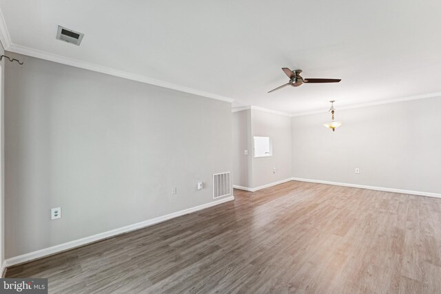 18330 Streamside Dr Unit 303, Gaithersburg, MD 20879 - unfurnished room with ornamental molding, wood finished floors, and ceiling fan