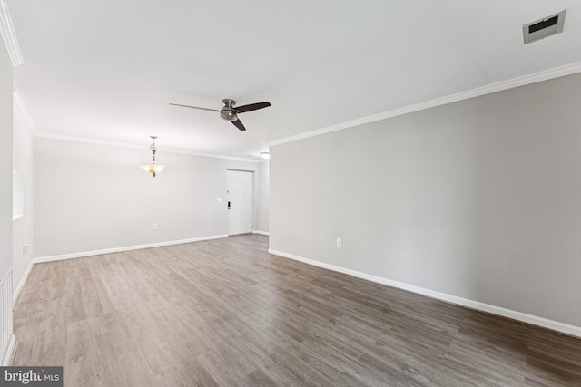 18330 Streamside Dr Unit 303, Gaithersburg, MD 20879 - spare room with crown molding, a ceiling fan, and wood finished floors