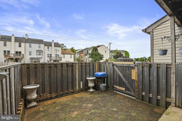 10519 Stonington Ln, Manassas, VA 20109 - view of patio / terrace with a gate, a residential view, and a grill