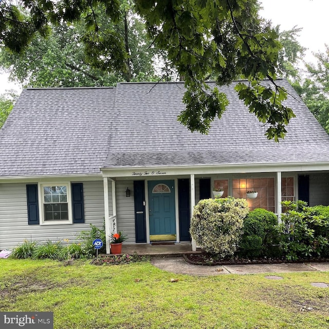 2207 Harwood Ln, Bowie, MD 20716 - view of front of home featuring a front lawn, roof with shingles, and covered porch