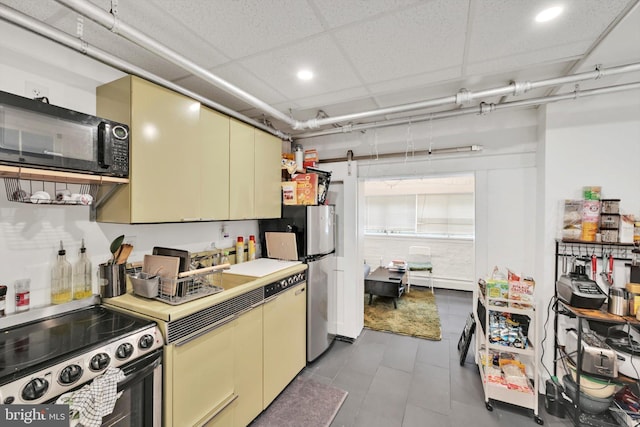 1622 Delaware Ave, Wyomissing, PA 19610 - kitchen with stainless steel appliances, cream cabinets, light countertops, recessed lighting, and tile patterned flooring