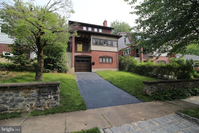 1622 Delaware Ave, Wyomissing, PA 19610 - view of front of property featuring a garage, driveway, a chimney, a front lawn, and a balcony
