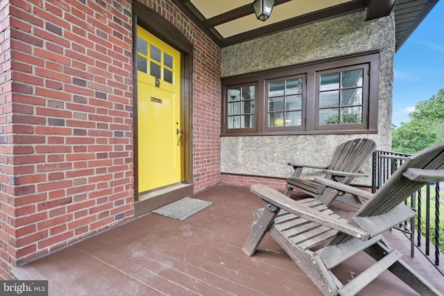 1622 Delaware Ave, Wyomissing, PA 19610 - doorway to property with brick siding, stucco siding, and covered porch
