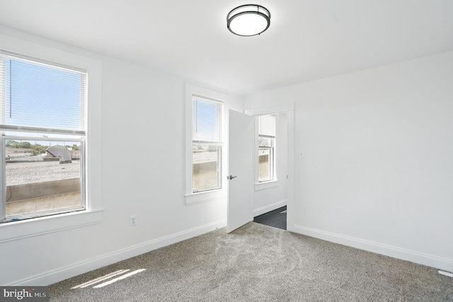2105 Maisel St, Baltimore, MD 21230 - carpeted empty room featuring baseboards
