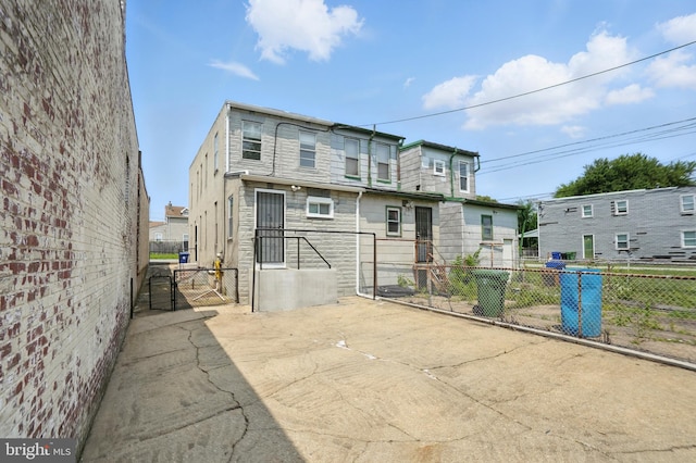 2105 Maisel St, Baltimore, MD 21230 - back of property featuring a gate and stone siding