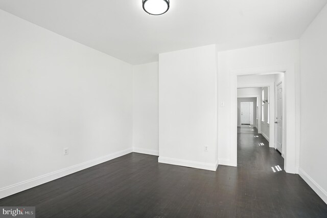 2105 Maisel St, Baltimore, MD 21230 - empty room featuring dark wood-style flooring and baseboards