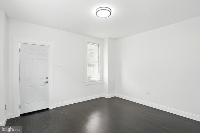 2105 Maisel St, Baltimore, MD 21230 - spare room with baseboards and dark wood-style flooring