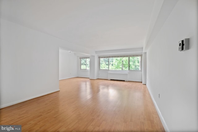 4201 Cathedral Ave NW Unit 303E, Washington, DC 20016 - empty room featuring light wood-style floors and radiator