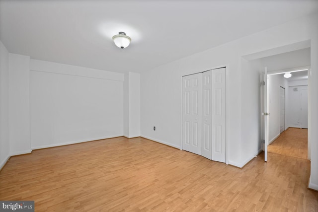 4201 Cathedral Ave NW Unit 303E, Washington, DC 20016 - unfurnished bedroom featuring light wood-style floors and a closet