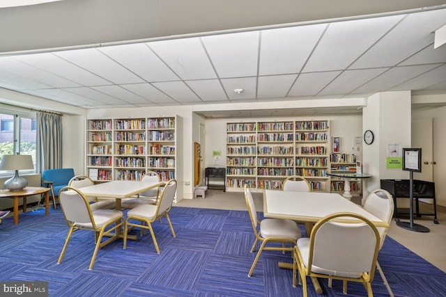 4201 Cathedral Ave NW Unit 303E, Washington, DC 20016 - carpeted dining space featuring built in features and a paneled ceiling
