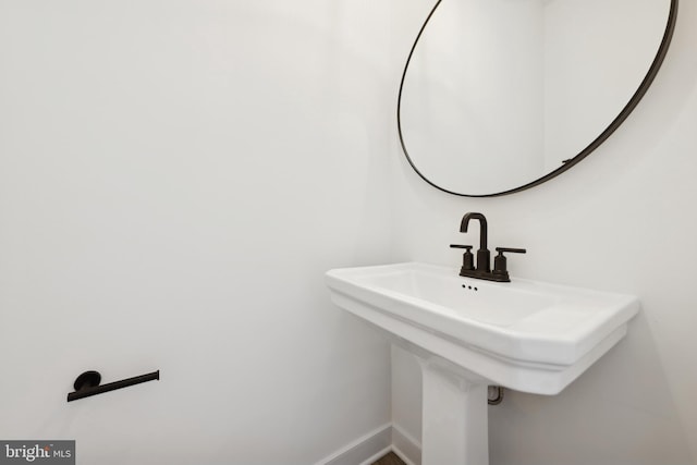 19740 Spinnaker Ct, Georgetown, DE 19947 - bathroom with a sink and baseboards