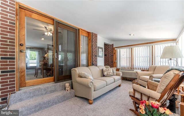 3324 Golf Course Rd, Allentown, PA 18104 - living room with brick wall and a ceiling fan