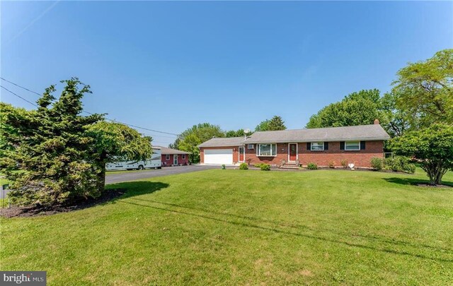 3324 Golf Course Rd, Allentown, PA 18104 - ranch-style house featuring asphalt driveway, a front yard, brick siding, and a chimney