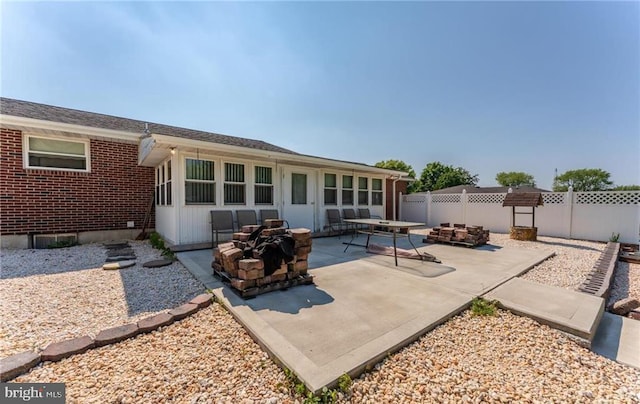3324 Golf Course Rd, Allentown, PA 18104 - back of property with a fire pit, a patio area, and brick siding