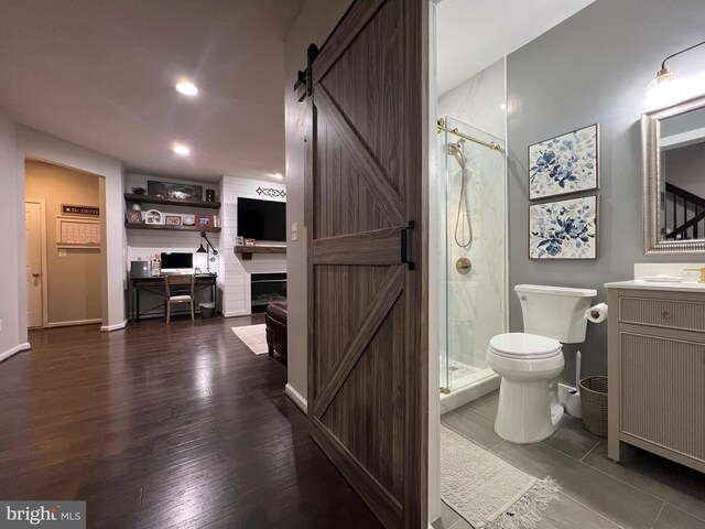 13755 Tides St, Woodbridge, VA 22191 - bathroom with a shower stall, vanity, recessed lighting, and wood finished floors