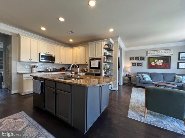 13755 Tides St, Woodbridge, VA 22191 - kitchen featuring appliances with stainless steel finishes, ornamental molding, open floor plan, dark stone counters, and dark wood-type flooring