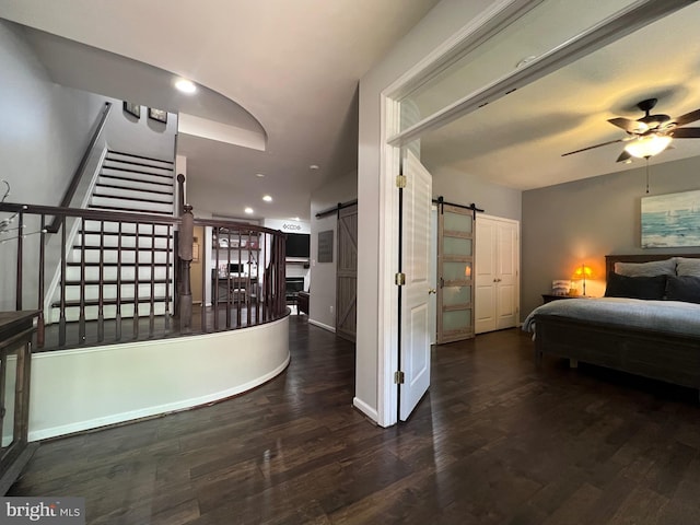 13755 Tides St, Woodbridge, VA 22191 - bedroom featuring a barn door, recessed lighting, and wood finished floors