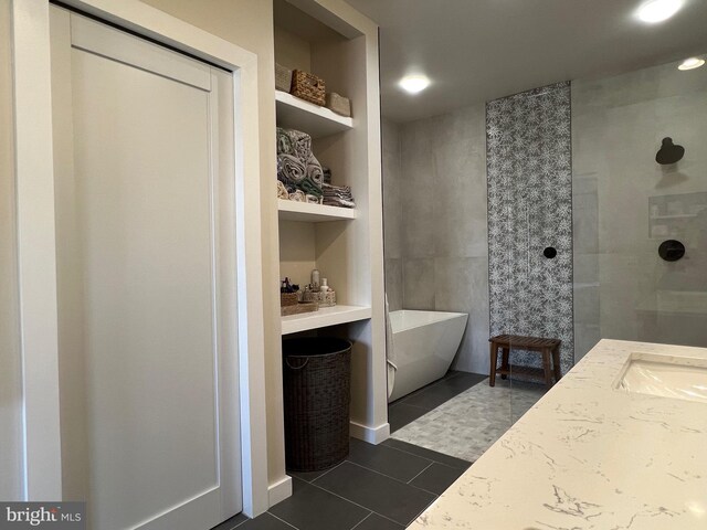 13755 Tides St, Woodbridge, VA 22191 - full bath featuring a freestanding tub, tile patterned flooring, vanity, and a tile shower