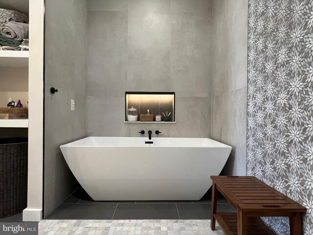 13755 Tides St, Woodbridge, VA 22191 - bathroom featuring a freestanding tub and tile patterned flooring