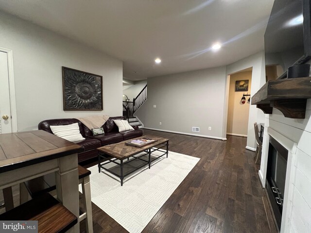 13755 Tides St, Woodbridge, VA 22191 - living area featuring stairway, recessed lighting, dark wood-type flooring, and a glass covered fireplace