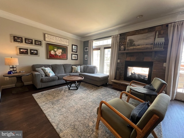 13755 Tides St, Woodbridge, VA 22191 - living area with ornamental molding, dark wood-style flooring, plenty of natural light, and a fireplace