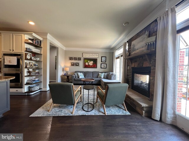 13755 Tides St, Woodbridge, VA 22191 - living room featuring ornamental molding, dark wood finished floors, a stone fireplace, and recessed lighting