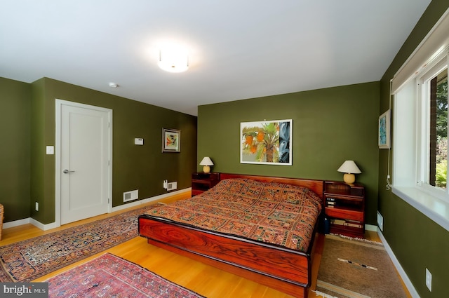 4305 Blagden Ave NW, Washington, DC 20011 - bedroom with baseboards and wood finished floors