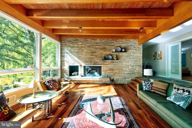 4305 Blagden Ave NW, Washington, DC 20011 - living area featuring plenty of natural light, a wood ceiling with exposed beams, wood finished floors, and a stone fireplace