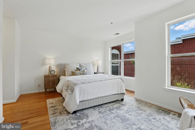 2127 12th Pl NW, Washington, DC 20009 - bedroom with light wood finished floors and baseboards
