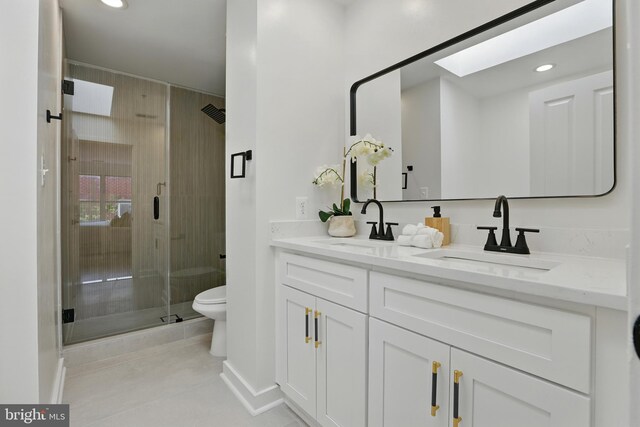 2127 12th Pl NW, Washington, DC 20009 - full bath with double vanity, a shower stall, a skylight, tile patterned flooring, and recessed lighting