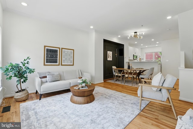 2127 12th Pl NW, Washington, DC 20009 - living area with wood finished floors, a chandelier, recessed lighting, and crown molding