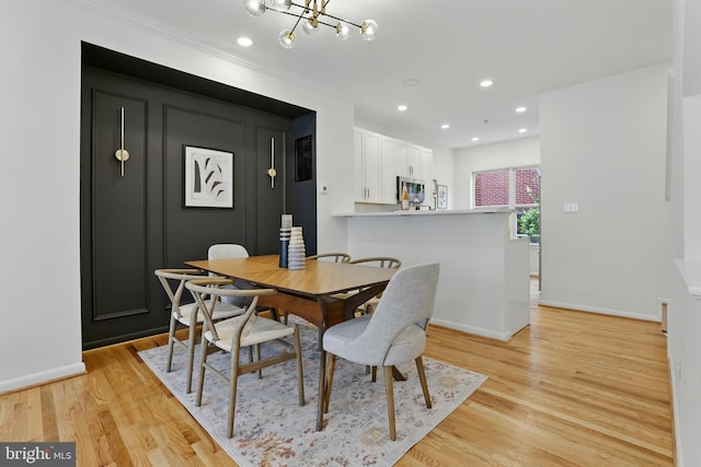 2127 12th Pl NW, Washington, DC 20009 - dining area with light wood-style flooring, a chandelier, recessed lighting, and crown molding