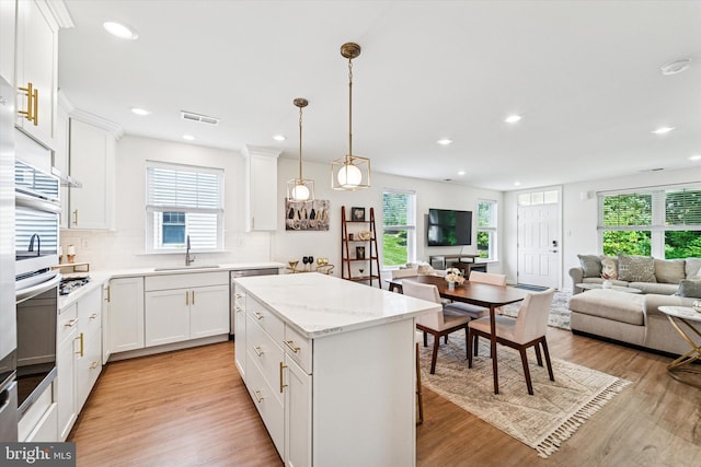 512 S Media Way, Media, PA 19063 - kitchen featuring open floor plan, light wood-type flooring, decorative backsplash, plenty of natural light, and recessed lighting