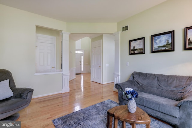 213 Casper Way, Middletown, DE 19709 - living area featuring ornate columns and light wood-style flooring