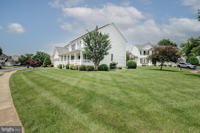 213 Casper Way, Middletown, DE 19709 - view of property exterior with a lawn, a garage, and a porch