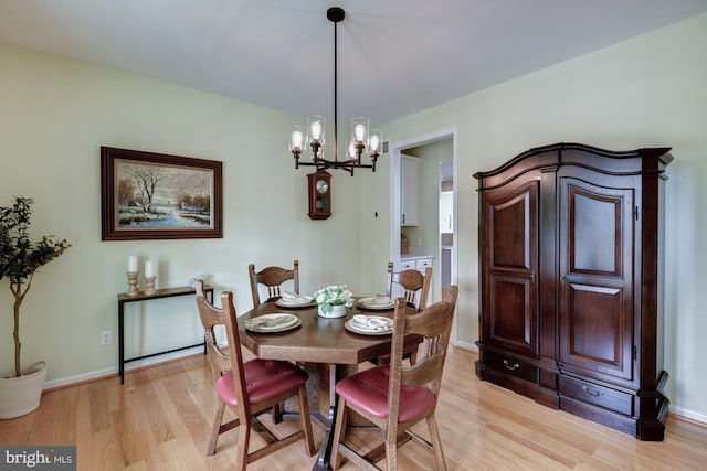 213 Casper Way, Middletown, DE 19709 - dining area with light wood-style floors and a chandelier