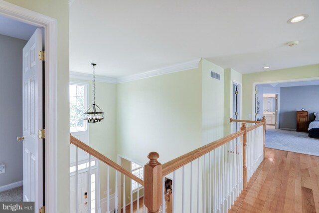 213 Casper Way, Middletown, DE 19709 - hallway with an upstairs landing, light wood-type flooring, recessed lighting, a chandelier, and crown molding