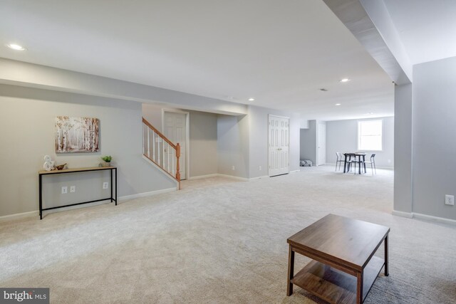 213 Casper Way, Middletown, DE 19709 - unfurnished living room featuring light colored carpet, stairs, and recessed lighting