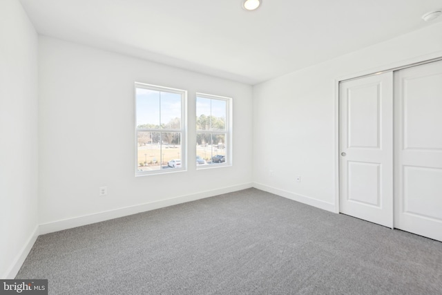 19712 Crows Nest Ct, Georgetown, DE 19947 - unfurnished bedroom featuring carpet, baseboards, a closet, and recessed lighting