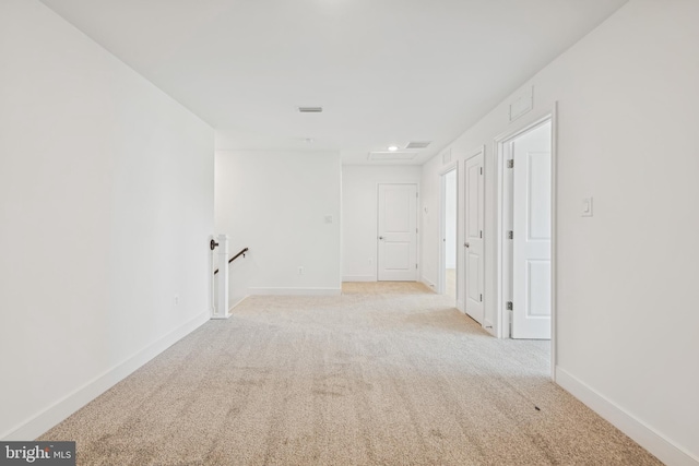 19712 Crows Nest Ct, Georgetown, DE 19947 - hall with an upstairs landing, light colored carpet, and baseboards