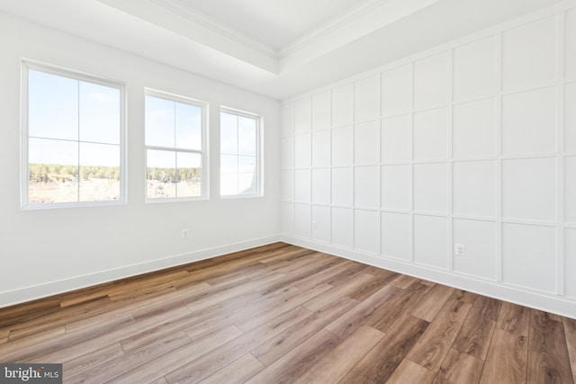 19712 Crows Nest Ct, Georgetown, DE 19947 - empty room with ornamental molding, wood finished floors, a raised ceiling, and baseboards