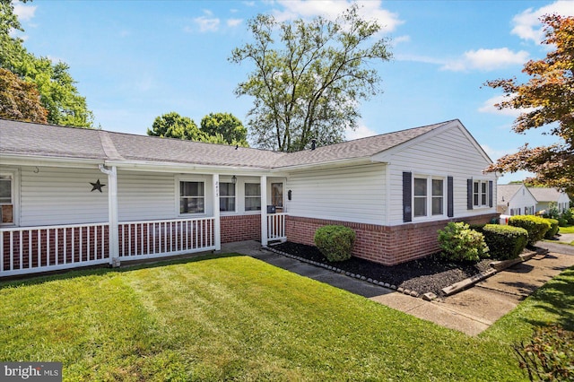 8413 Hallmark Cir, Baltimore, MD 21234 - view of front facade with brick siding and a front yard